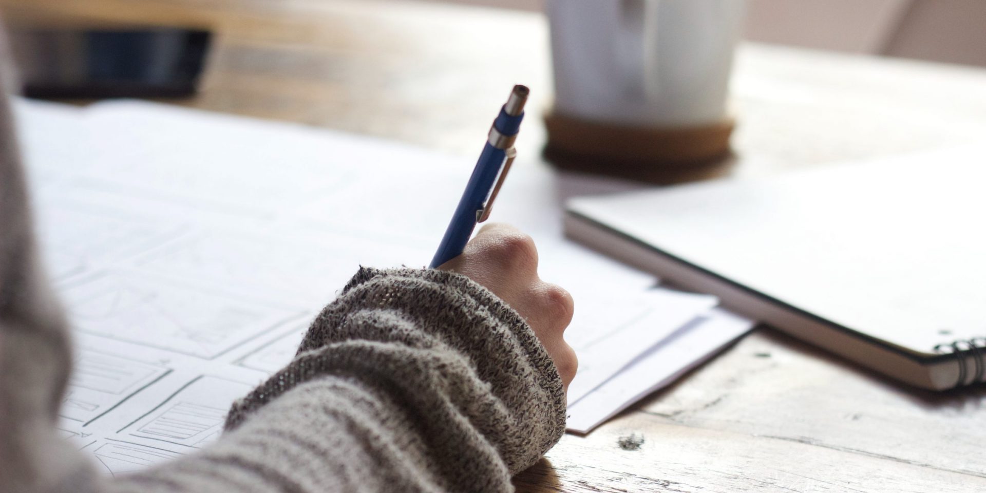 Student writing a persuasive personal statement