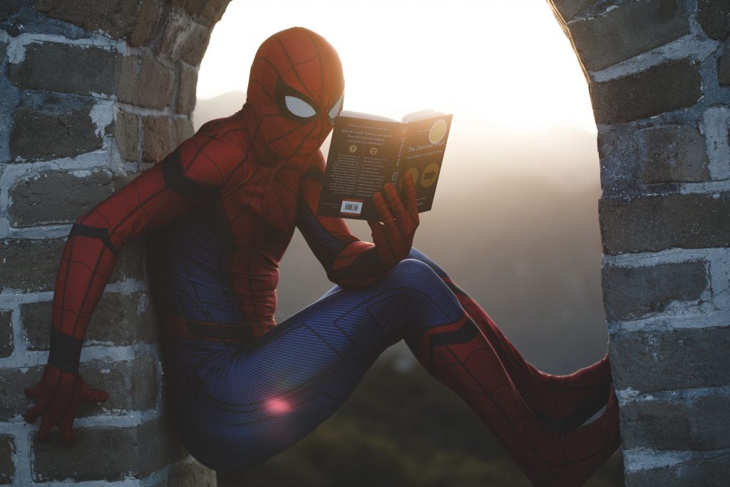 Spiderman reading a persuasive personal statement